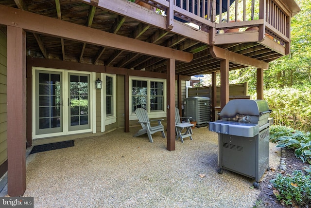 view of patio with a grill and central AC unit