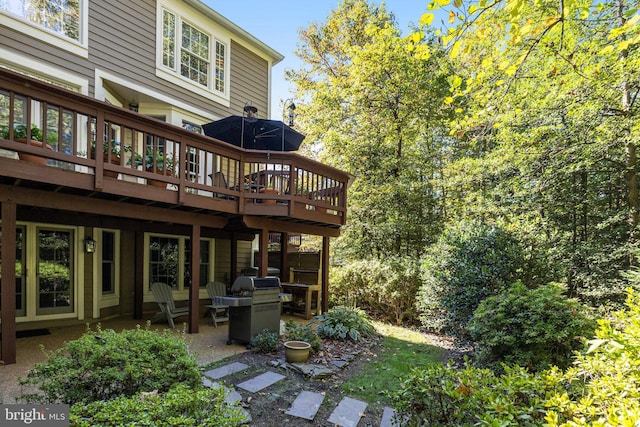 back of house featuring a wooden deck