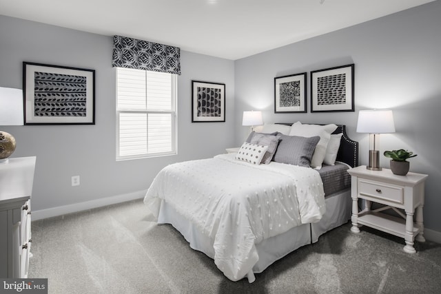 bedroom with dark colored carpet