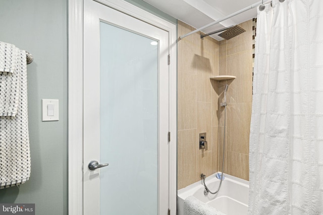 bathroom with shower / bath combo with shower curtain