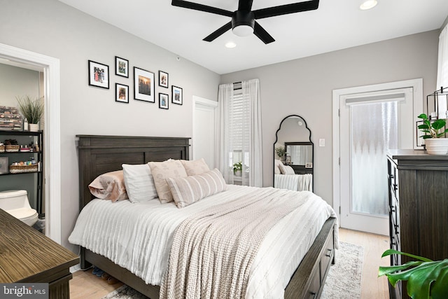 bedroom featuring light hardwood / wood-style flooring and ceiling fan