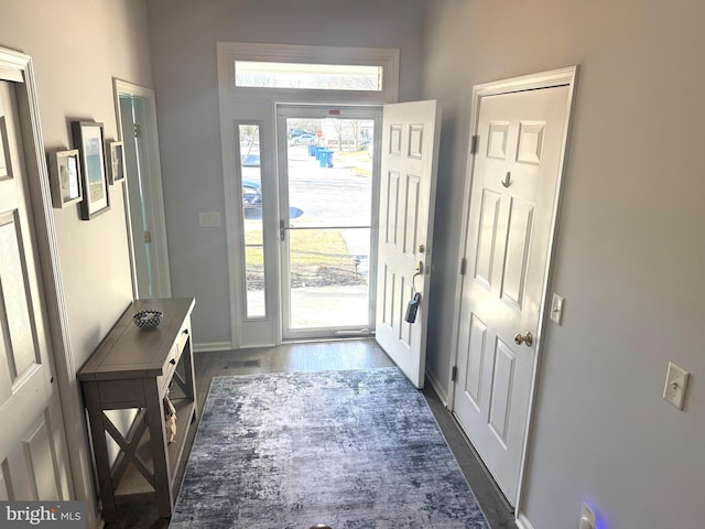 entryway with dark hardwood / wood-style floors