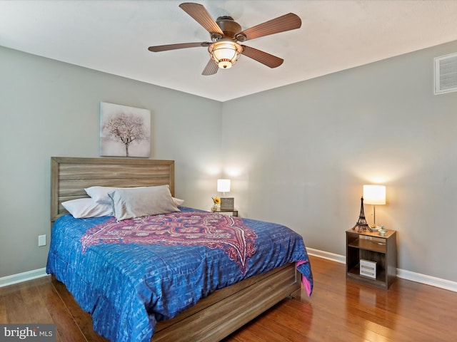 bedroom featuring dark wood-type flooring and ceiling fan