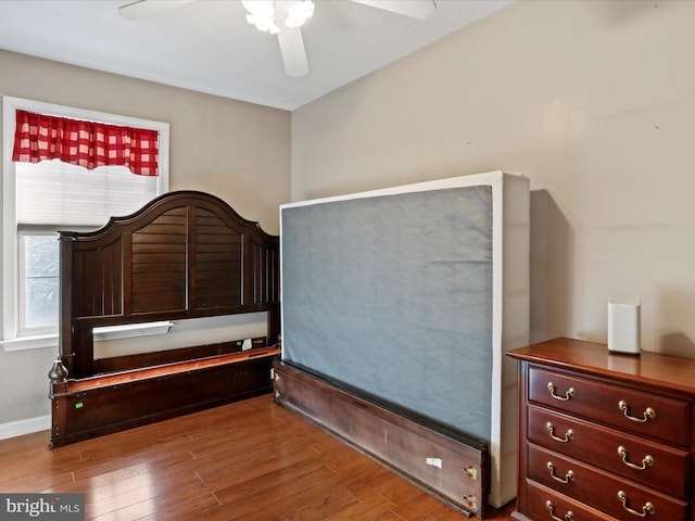 bedroom featuring ceiling fan and wood-type flooring