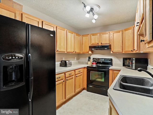 kitchen featuring sink, black appliances, a textured ceiling, and light brown cabinets