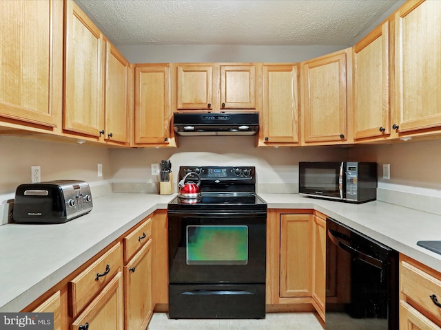 kitchen with light brown cabinetry, a textured ceiling, and black appliances