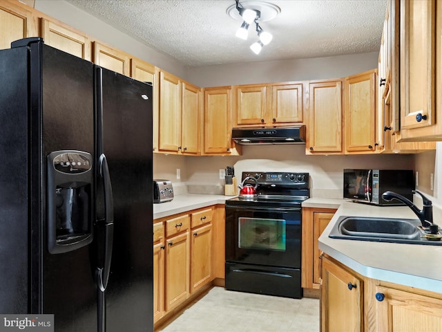 kitchen with sink, light brown cabinets, a textured ceiling, and black appliances