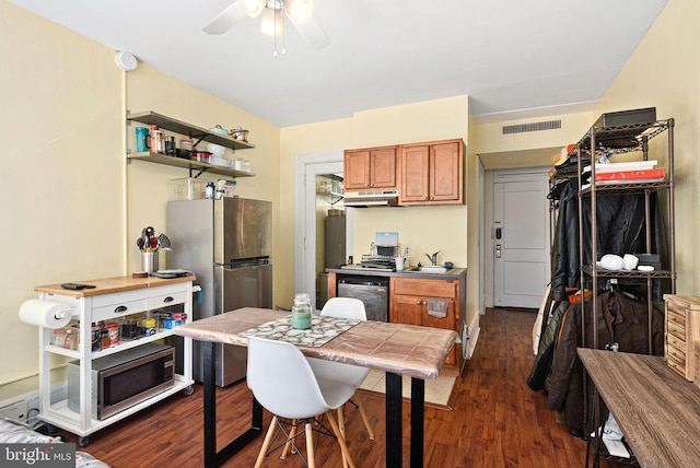 kitchen with stainless steel refrigerator, ceiling fan, dishwasher, dark hardwood / wood-style floors, and tile countertops