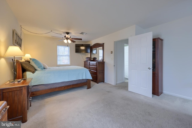 bedroom with light carpet and ceiling fan