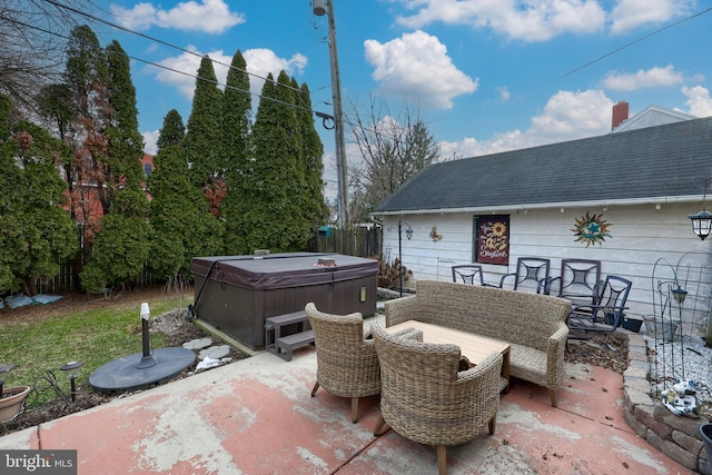 view of patio / terrace featuring an outdoor living space and a hot tub