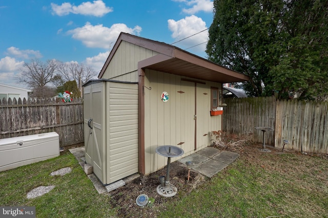 view of outdoor structure with a lawn