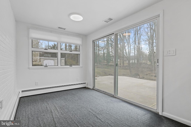 carpeted empty room featuring a baseboard radiator