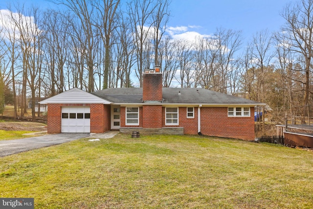 exterior space with a garage and a front yard