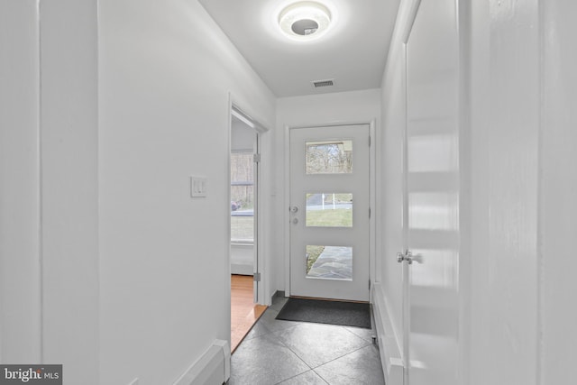 doorway featuring tile patterned floors