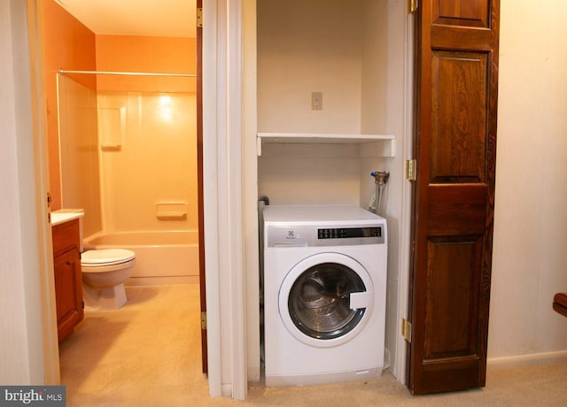 washroom with washer / clothes dryer