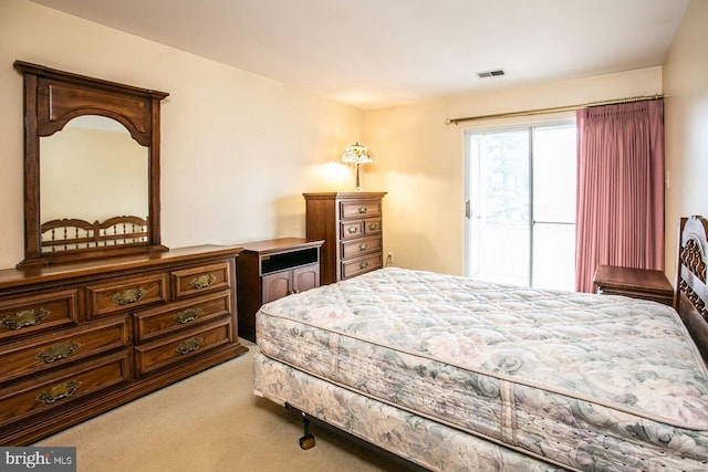 bedroom with light colored carpet