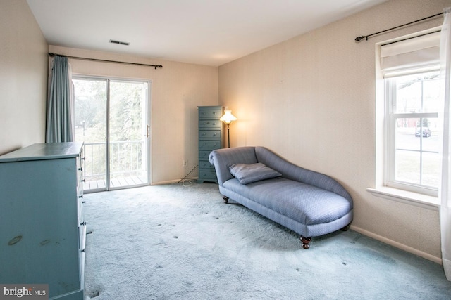 living area with light colored carpet and plenty of natural light