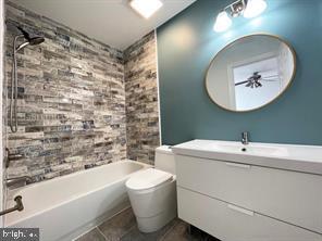 full bathroom featuring vanity, tile patterned floors, bathtub / shower combination, and toilet