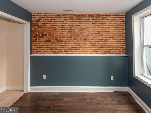 unfurnished room with hardwood / wood-style floors