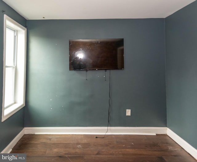 empty room featuring hardwood / wood-style floors and a wealth of natural light