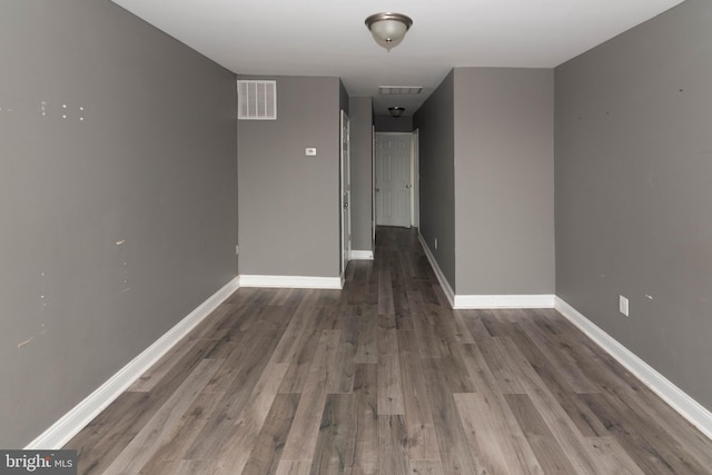 hall with dark hardwood / wood-style flooring