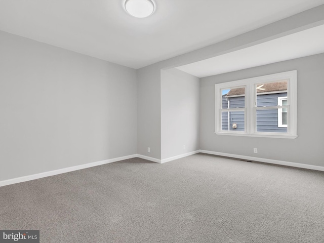 unfurnished room with carpet flooring