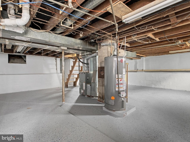 basement featuring gas water heater and heating unit