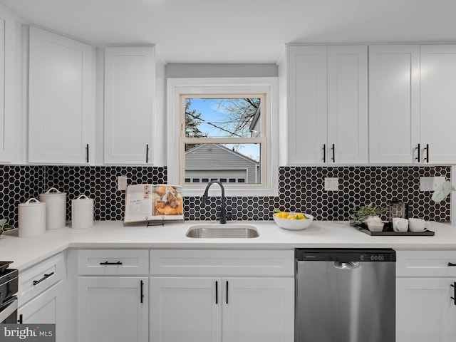 kitchen with white cabinetry, stainless steel dishwasher, and sink