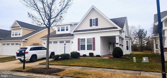 view of front of home featuring a garage and a front lawn