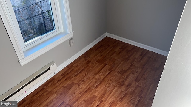 room details with a baseboard radiator and wood-type flooring