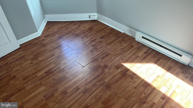 room details with hardwood / wood-style floors and a baseboard radiator