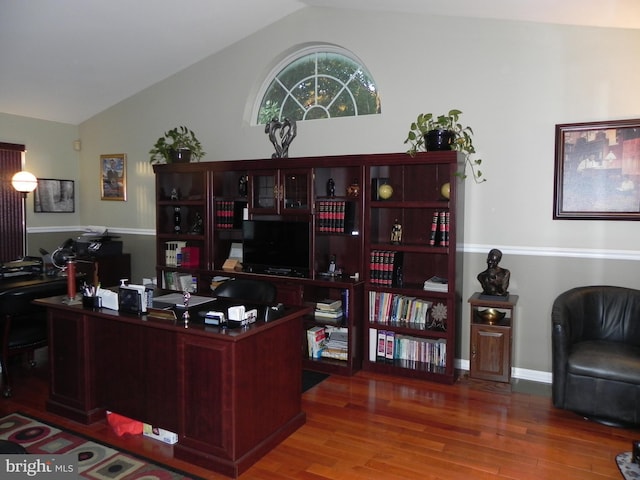 office space with hardwood / wood-style flooring and lofted ceiling