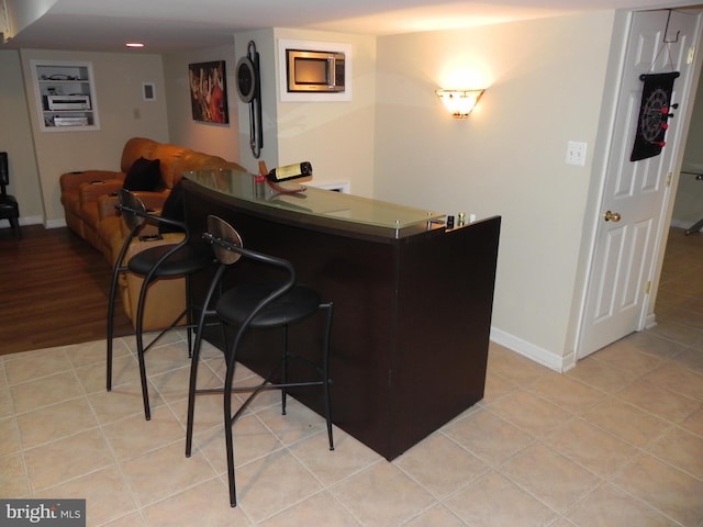 bar with light tile patterned floors