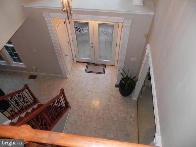 foyer entrance featuring french doors