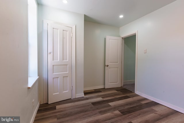 hallway featuring dark hardwood / wood-style flooring