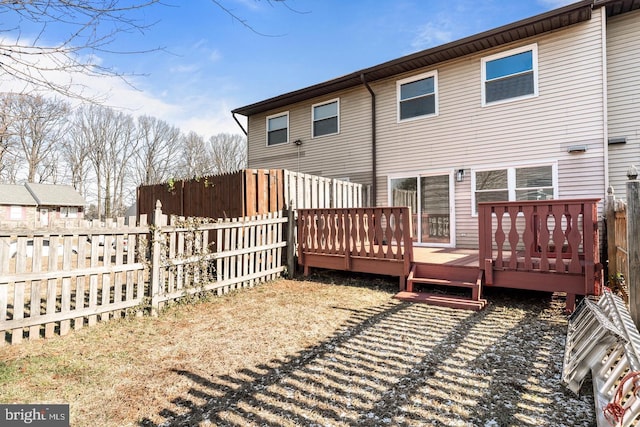 back of house featuring a deck