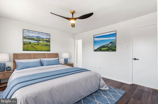 bedroom with dark wood-type flooring and ceiling fan