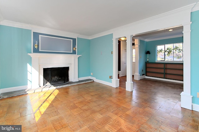 unfurnished living room featuring ornamental molding, a fireplace, and decorative columns