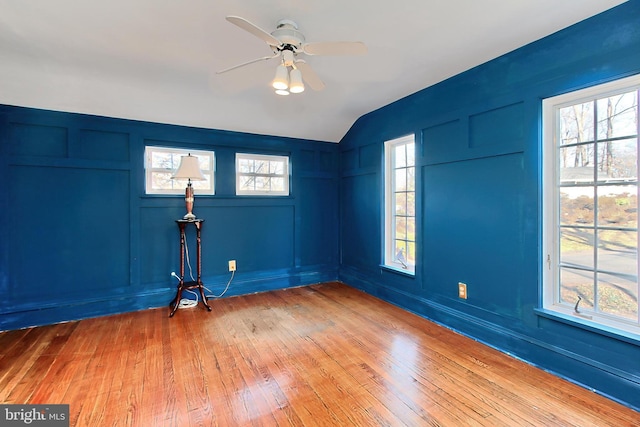 entrance foyer featuring ceiling fan, lofted ceiling, and wood-type flooring