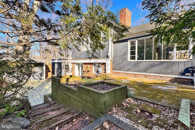 view of yard featuring a wooden deck and an outdoor fire pit