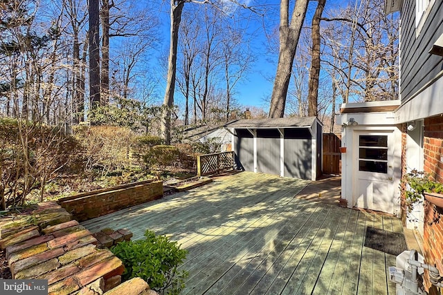 wooden deck featuring a shed