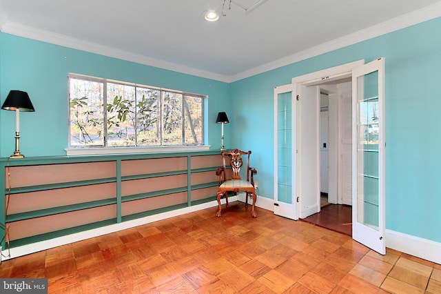 living area featuring light parquet flooring and crown molding