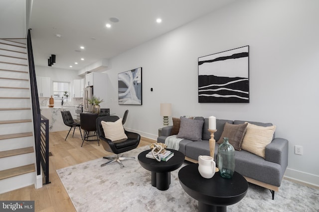 living room with light hardwood / wood-style flooring