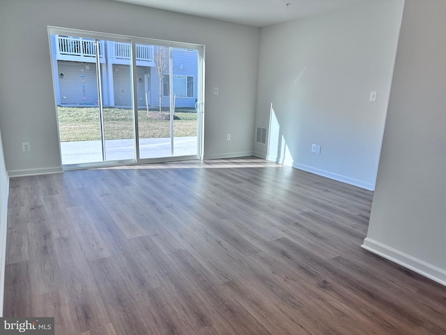 spare room featuring hardwood / wood-style flooring