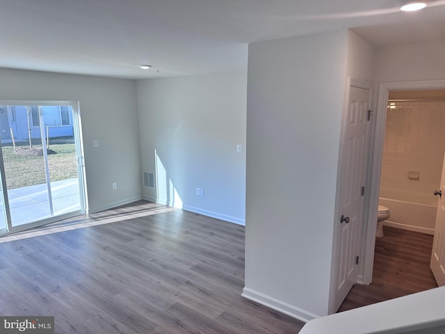 unfurnished room featuring hardwood / wood-style flooring