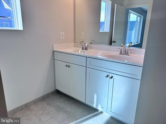 bathroom with vanity and tile patterned floors