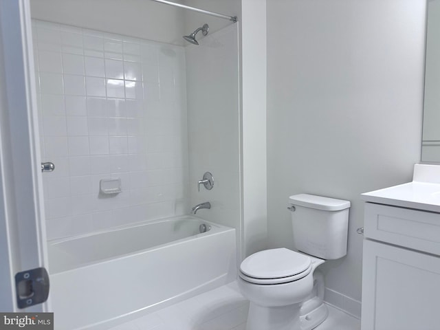 full bathroom featuring vanity, tiled shower / bath combo, tile patterned floors, and toilet