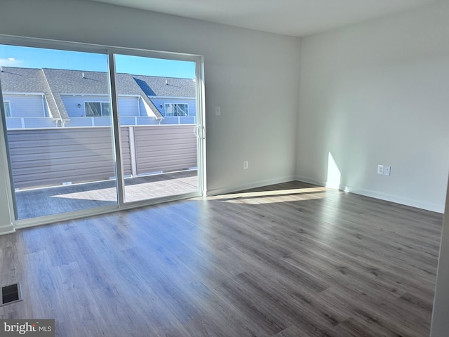 empty room featuring hardwood / wood-style flooring