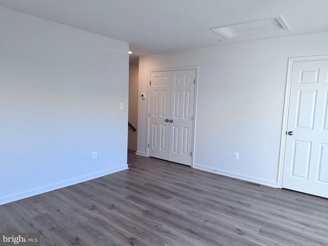 empty room featuring dark wood-type flooring