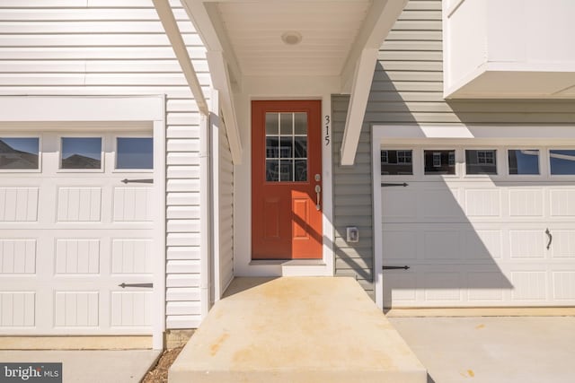 entrance to property featuring a garage